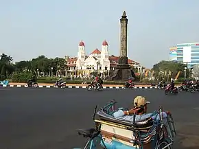 The NIS headquarters on the left and Tugu Muda stone monument, representing the 5 days war in Semarang during Revolution