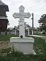 Cruce de piatră amplasată în curtea bisericii în anul 1888