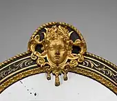 Mascaron pe rama unei oglinzi, circa 1700, în Muzeul Metropolitan de Artă