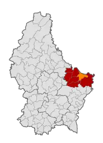 D'Gemeng Iechternach (orange) am Kanton Iechternach (rout)