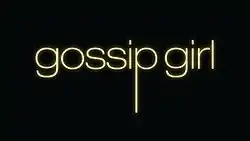 the words "gossip girl" written in yellow on a black background. The letters are lowercase and the letter 'p' has an elongated tail