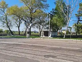 Panou la intrare în localitate de pe traseul M14.