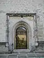 Intrarea de pe latura nordică în biserică, în prezent închisă