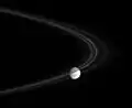 Mimas, behind the F Ring.