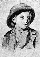 Cap de copil blond cu pălărie și haine nemțești