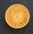 10 mărci de aur or (1880); pe revers: efigia lui Wilhelm I al Prusiei.