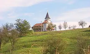 Biserica nouă de zid cu hramul „Intrarea în Biserică a Maicii Domnului” și „Sfânta Treime”