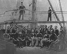 Group of men on the deck of a ship.