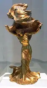 Lampă de masă, de François-Raoul Larche, de bronz aurit, care o înfățișează pe dansatoarea Loïe Fuller ca model (1901)