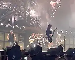 AC/DC, from left to right: Brian Johnson, Malcolm Young, Phil Rudd, Angus Young, Cliff Williams, performing at the Tacoma Dome in Tacoma, Washington on August 31, 2009.