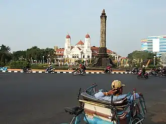The NIS headquarters on the left and Tugu Muda stone monument, representing the 5 days war in Semarang during Revolution