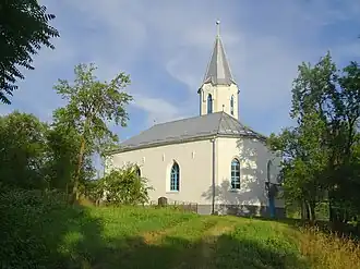 Biserica reformată din Sânmărtin (1926). Are același arhitect ca și Biserica reformată din Malin.