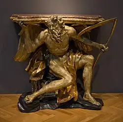 Masă barocă care îl înfățisează pe Chronos, sau tatăl timpului; 1695; lemn pictat și aurit, cu blat de marmură; 95,3 x 107,3 x 62,9 cm; Muzeul de Artă din Cleveland