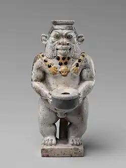 Vas cosmetic; 525–404 î.Hr.; faianță; înălțime: 9,2 cm, lățime: 4,4 cm; Muzeul Metropolitan de Artă