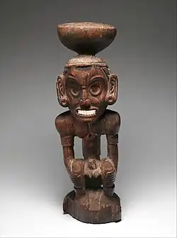 Figurina taino a unei zeități (zemi); secolele al XV-lea al XVI-lea; lemn și scoici; probabil din Republica Dominicană; Muzeul Metropolitan de Artă (New York City)