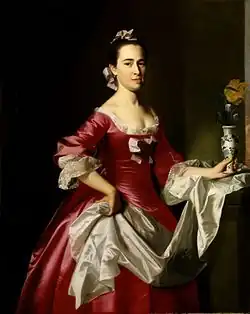 Doamna George Watson, de John Singleton Copley, 1765. Rochia roșie din satin a unui negustor înstărit din Boston arată succesul economic al soțului