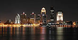 The Louisville downtown skyline at night, as viewed across the Ohio River from Southern Indiana, including the AEGON Center, the National City Tower, PNC Plaza, the Humana Building and the Galt House.