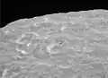 Mimas' albedo features on crater walls (Herschel at lower right)