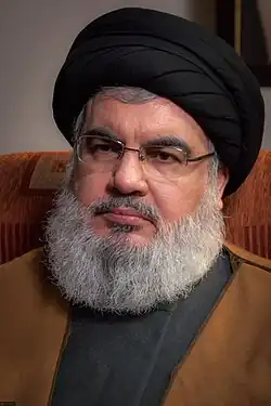 27 septembrie: Hassan Nasrallah, cleric, om politic și comandant libanez, secretar general al mișcării islamiste șiite Hezbollah din Liban