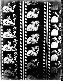 Three black-and-white film strips showing a woman and man facing each other and then eventually kissing. Each film strip has about five visible frames.