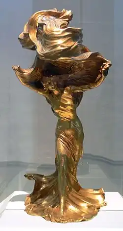 Lampă de masă, de François-Raoul Larche, de bronz aurit, care o înfățișează pe dansatoarea Loïe Fuller ca model (1901)